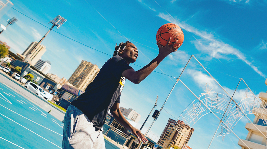 man aiming with the ball in the basket