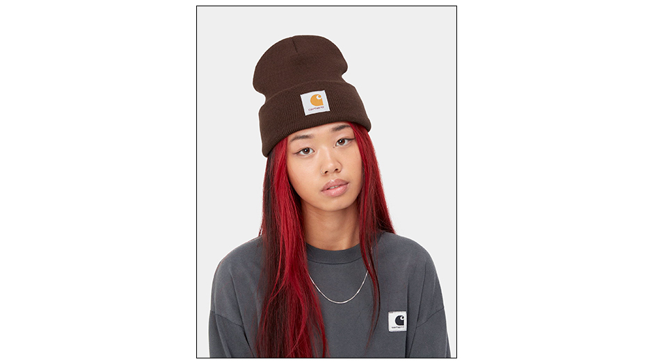 woman with red hair and brown beanie by carhartt